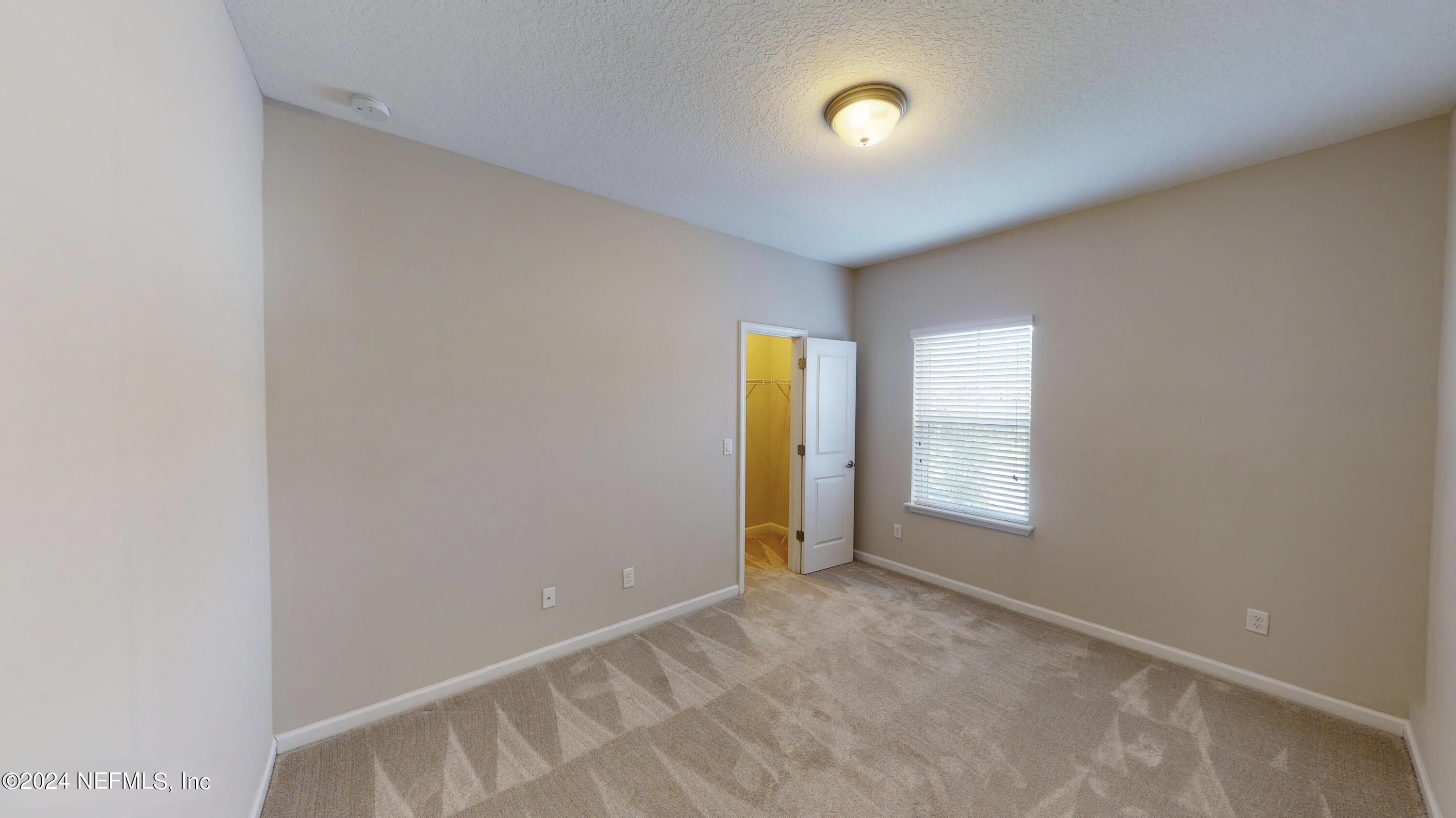 212 Concave Lane St. Augustine, FL 32095 - Photo 14 of 24 a view of an empty room with a window