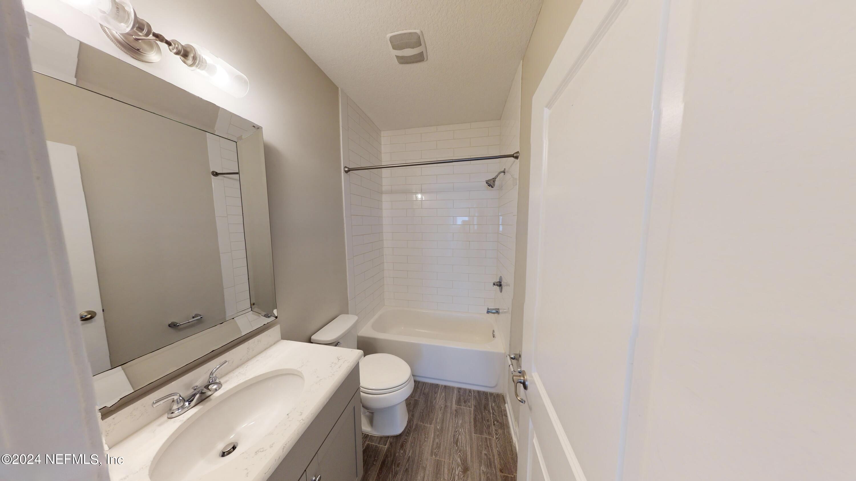 212 Concave Lane St. Augustine, FL 32095 - Photo 15 of 24 a bathroom with a sink toilet and shower
