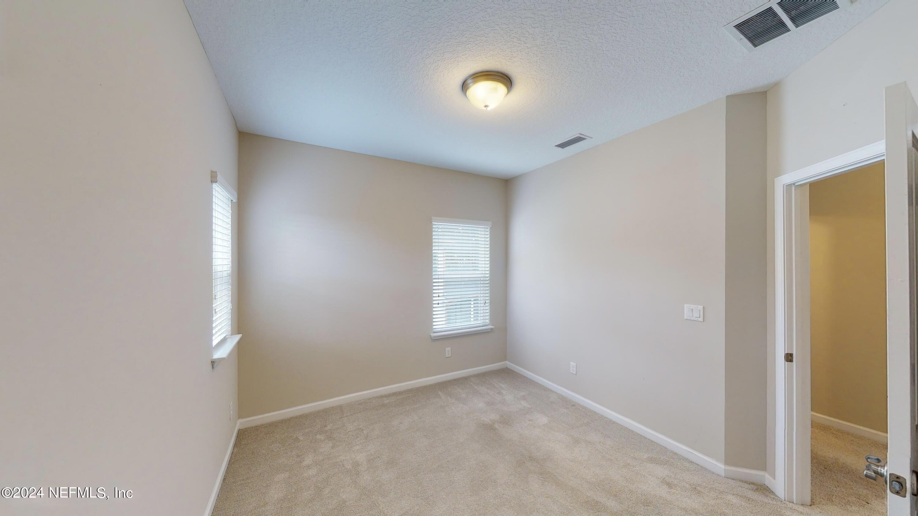212 Concave Lane St. Augustine, FL 32095 - Photo 16 of 24 an empty room with windows and closet