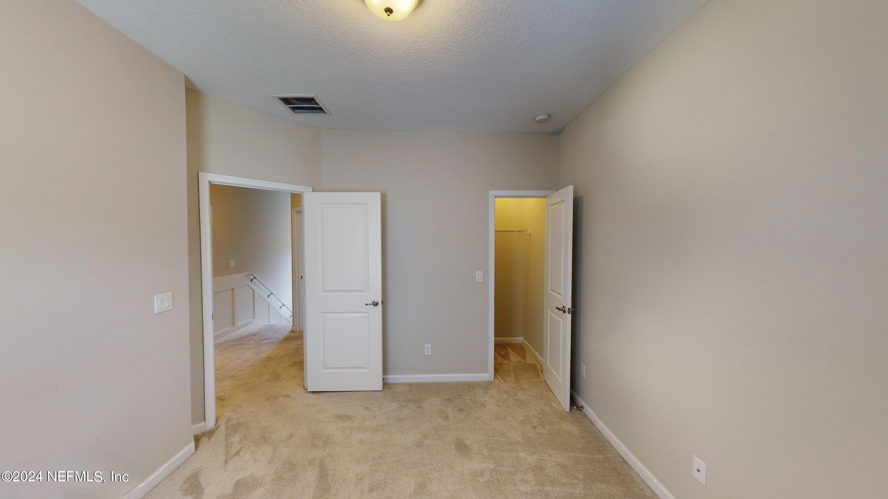 212 Concave Lane St. Augustine, FL 32095 - Photo 17 of 24 a view of an empty room with closet and a window