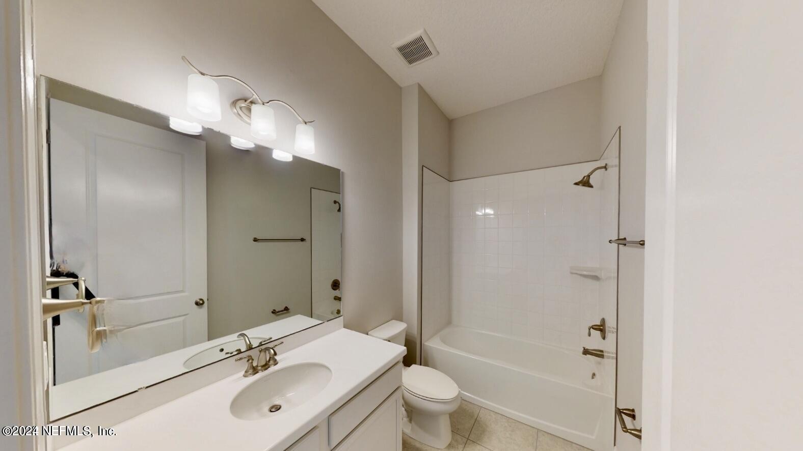 212 Concave Lane St. Augustine, FL 32095 - Photo 18 of 24 a bathroom with a sink a toilet and shower