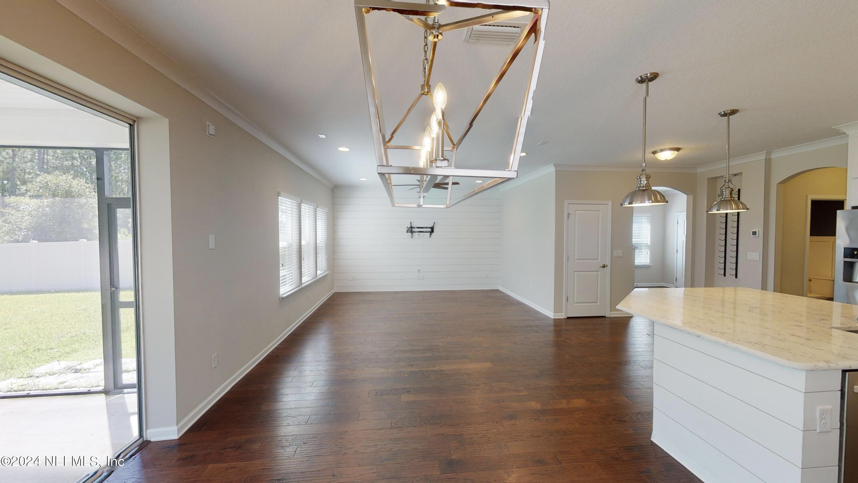 212 Concave Lane St. Augustine, FL 32095 - Photo 10 of 24 a view of a hallway view with wooden floor and a large window