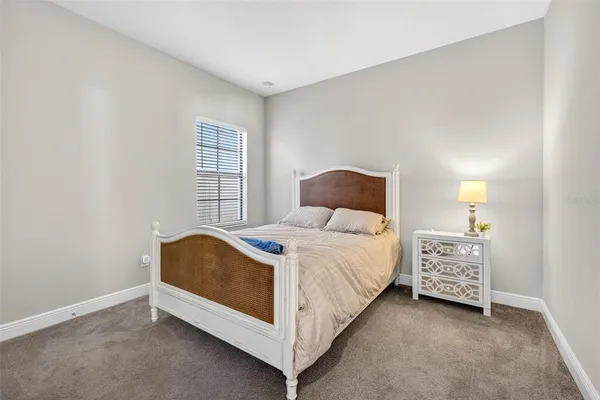 a view of hallway with window and stairs