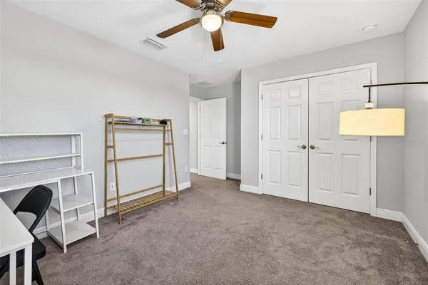 a bedroom with furniture and a window