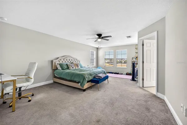 a bathroom with a double vanity sink mirror and shower