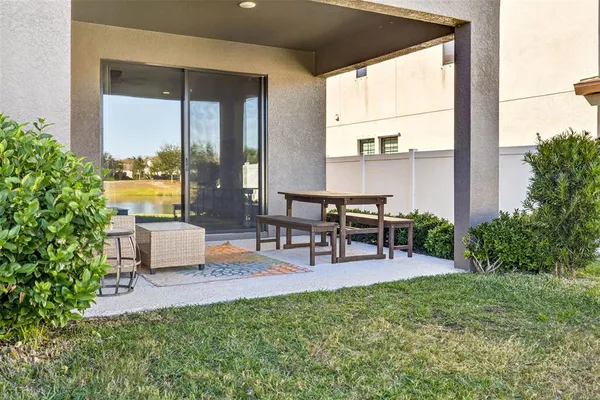 an aerial view of a house with a garden and swimming pool