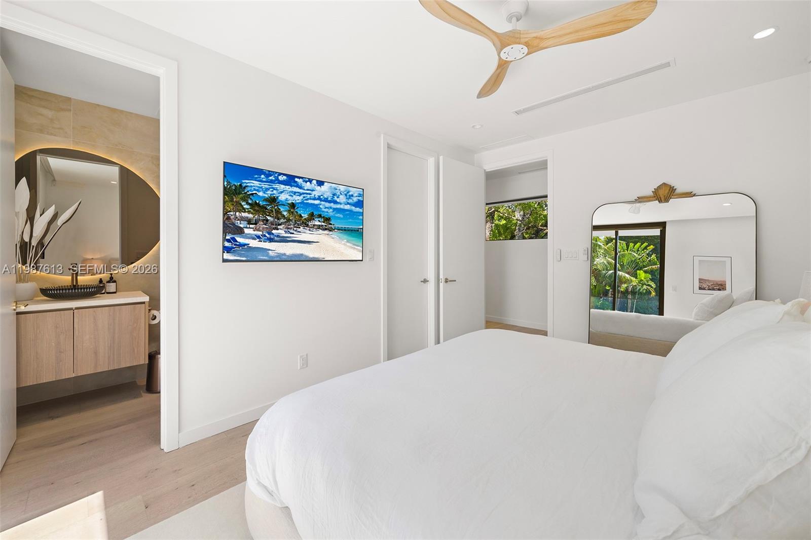 4041 South Le Jeune Road Miami, FL 33133 - Photo 12 of 30 a bedroom with a bed and a painting on the wall