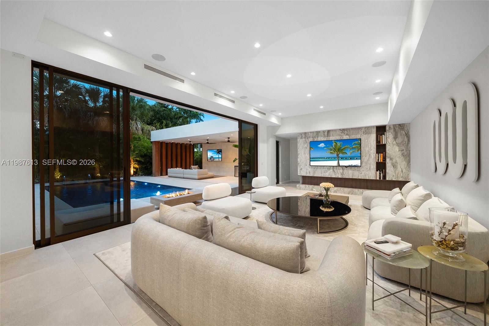 4041 South Le Jeune Road Miami, FL 33133 - Photo 13 of 26 a living room with furniture and a flat screen tv