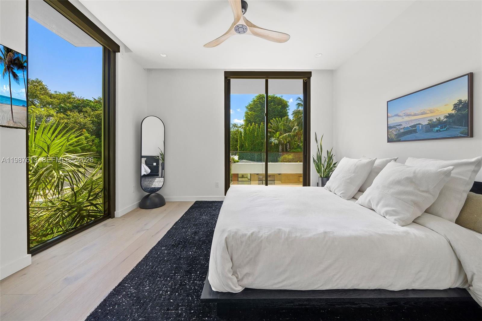 4041 South Le Jeune Road Miami, FL 33133 - Photo 15 of 30 a bedroom with a bed and a painting on the wall