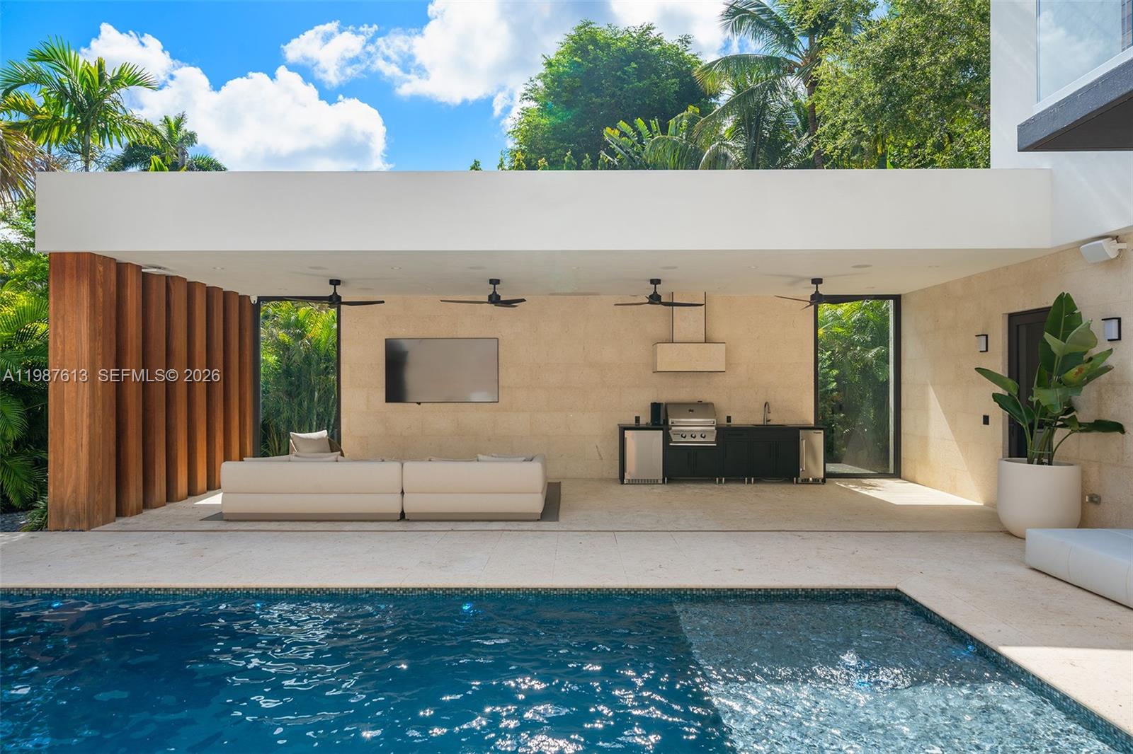 4041 South Le Jeune Road Miami, FL 33133 - Photo 5 of 30 a living room with furniture and a potted plant