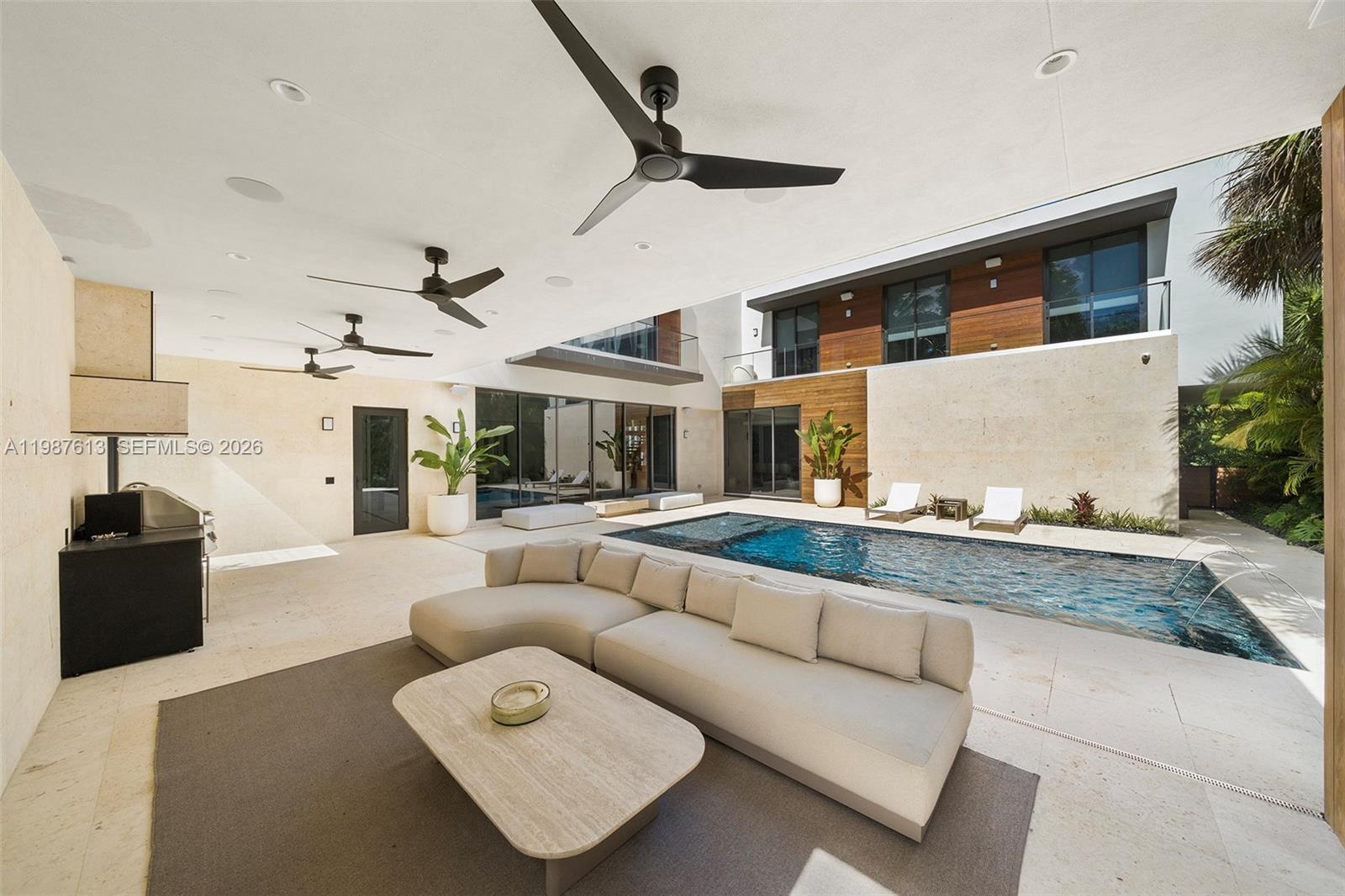 4041 South Le Jeune Road Miami, FL 33133 - Photo 6 of 30 a living room with furniture and a flat screen tv