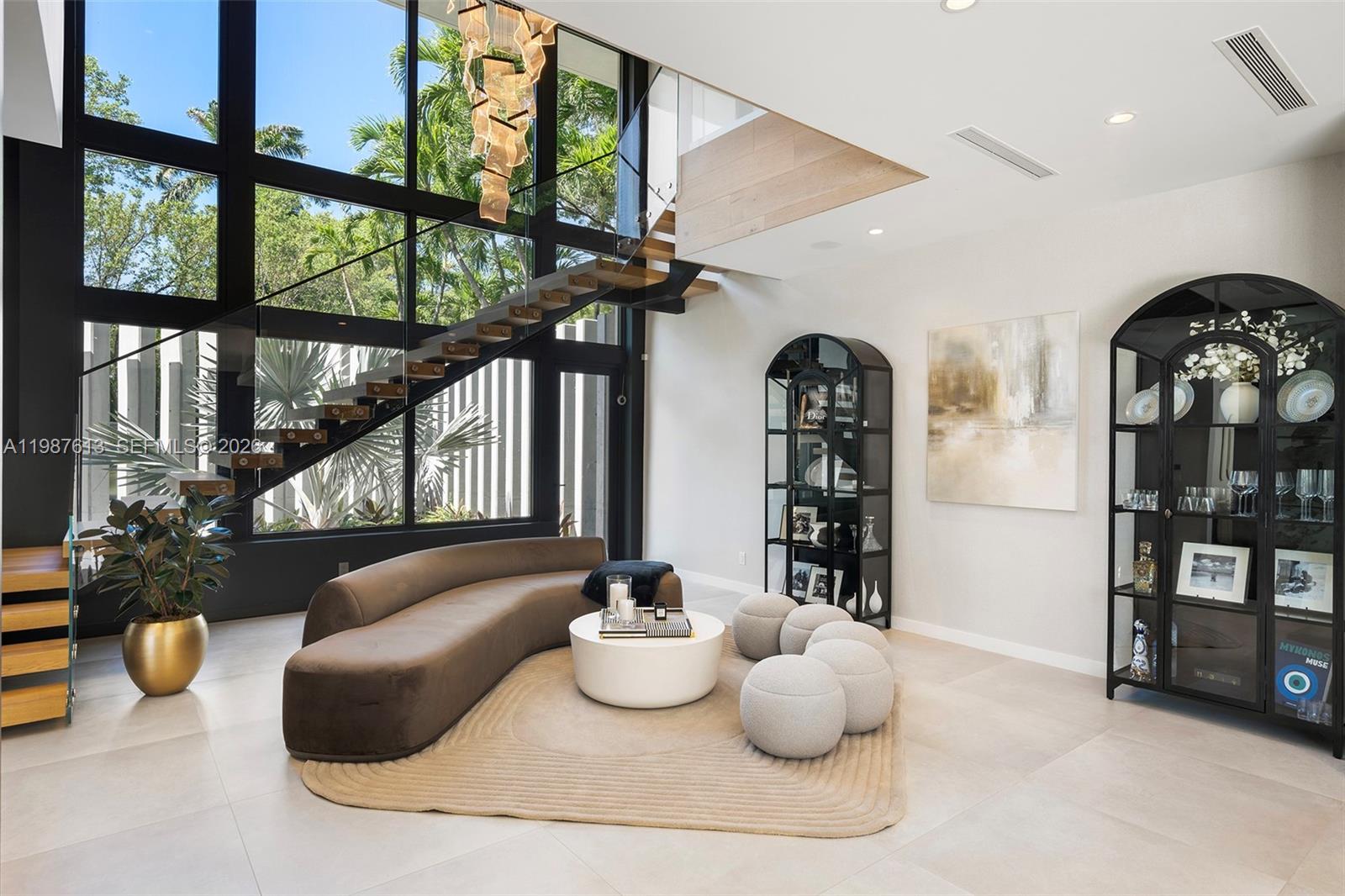 4041 South Le Jeune Road Miami, FL 33133 - Photo 6 of 26 a living room with furniture and a large window