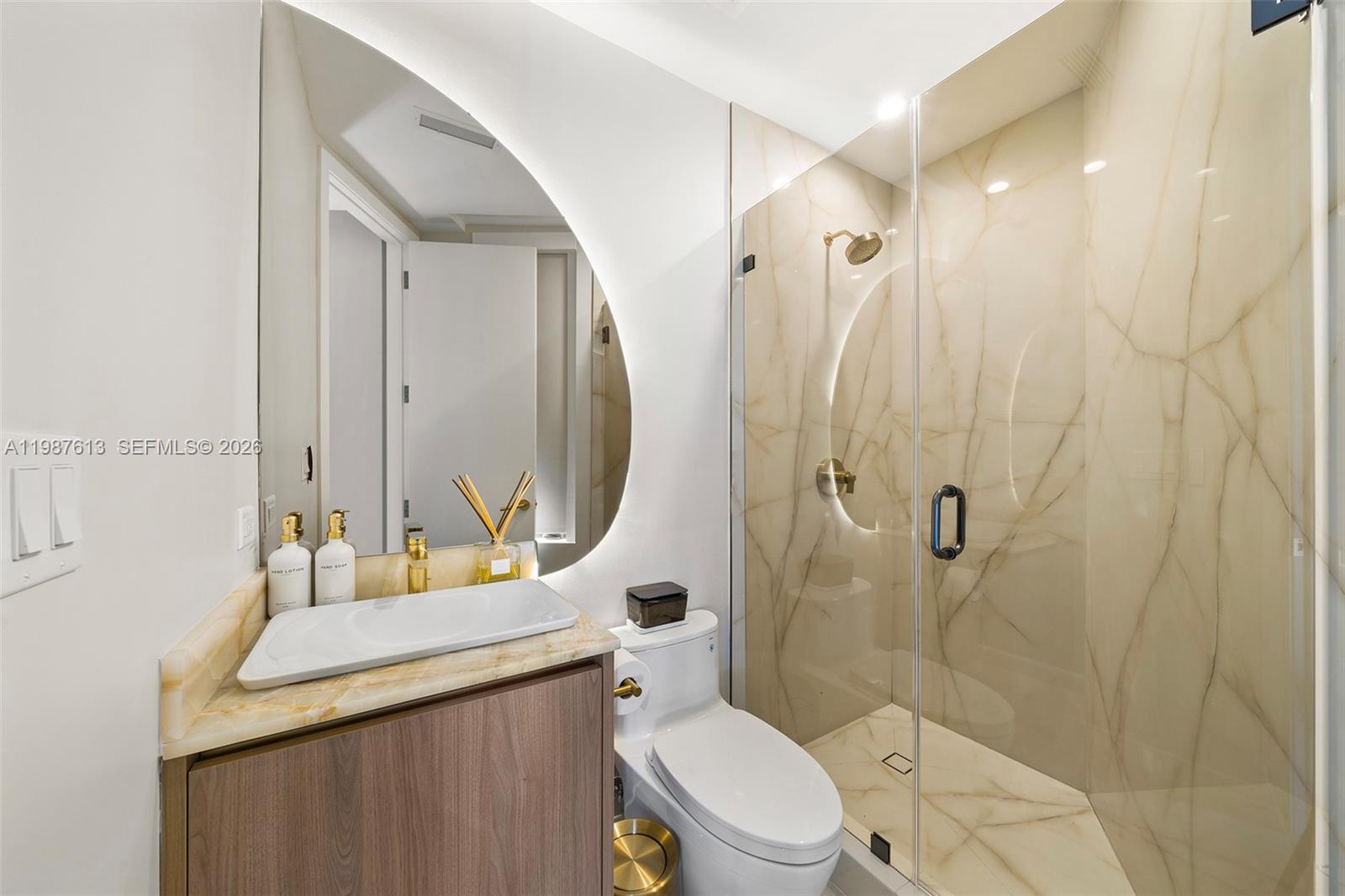 4041 South Le Jeune Road Miami, FL 33133 - Photo 7 of 30 a bathroom with a sink a toilet and shower