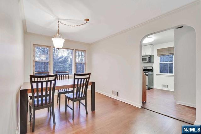 69 County Road Cresskill, NJ 07626 - Photo 6 of 20 a view of a dining room with furniture window and wooden floor