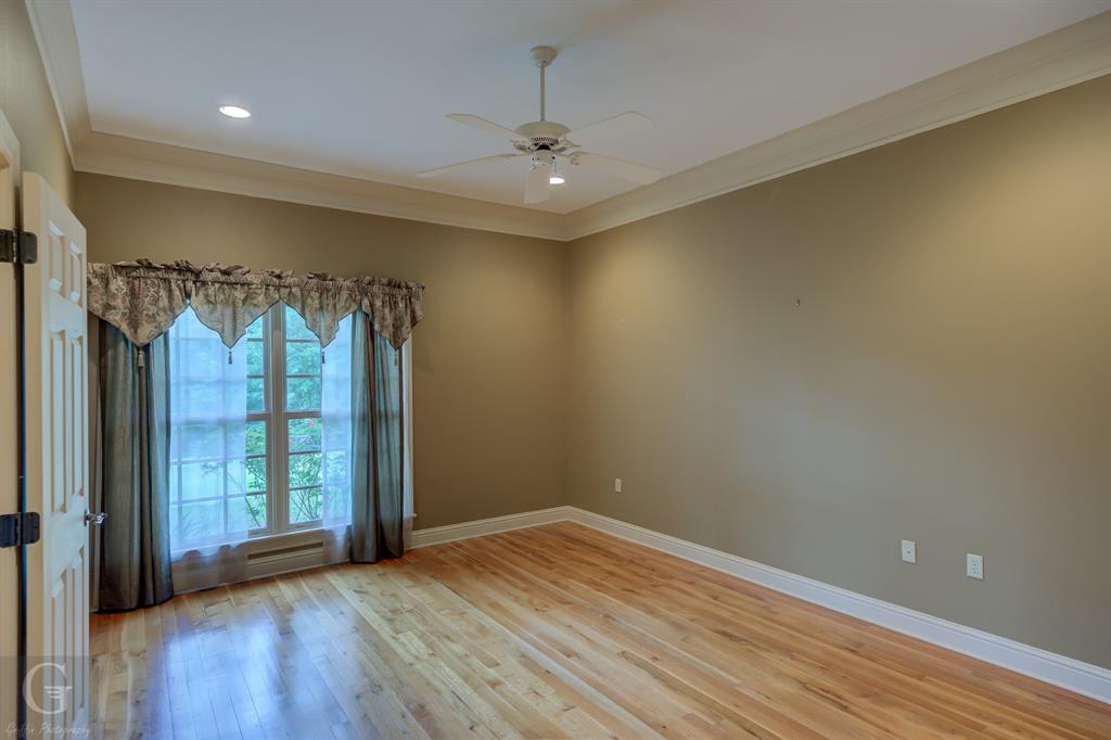 1212 WPA Road Homer, LA 71040 - Photo 29 of 35 Unfurnished room featuring crown molding, ceiling fan, light wood-style floors, baseboards, and recessed lighting