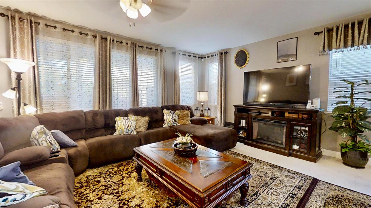 9573 Spring River Way Elk Grove, CA 95624 - Photo 15 of 53 a living room with furniture and a flat screen tv