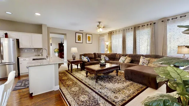 a living room with furniture and a rug