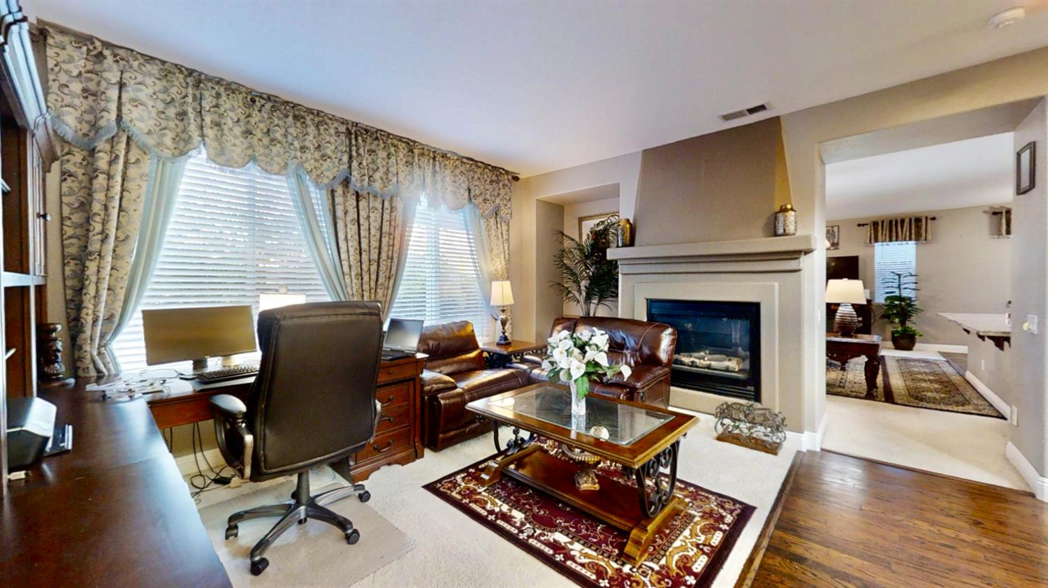 9573 Spring River Way Elk Grove, CA 95624 - Photo 22 of 53 a living room with furniture a fireplace and large window