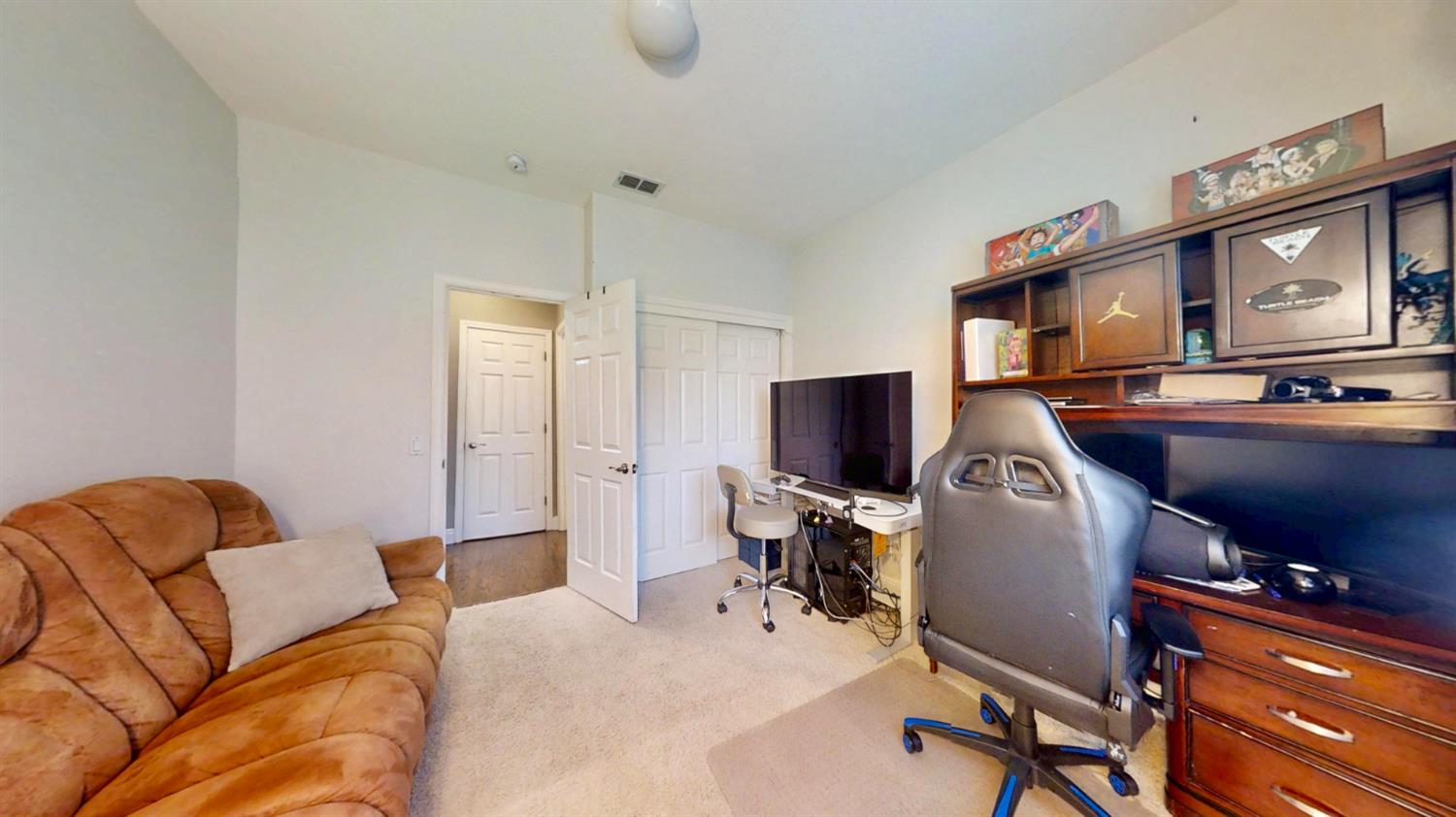 9573 Spring River Way Elk Grove, CA 95624 - Photo 27 of 53 a bedroom with furniture and a flat screen tv