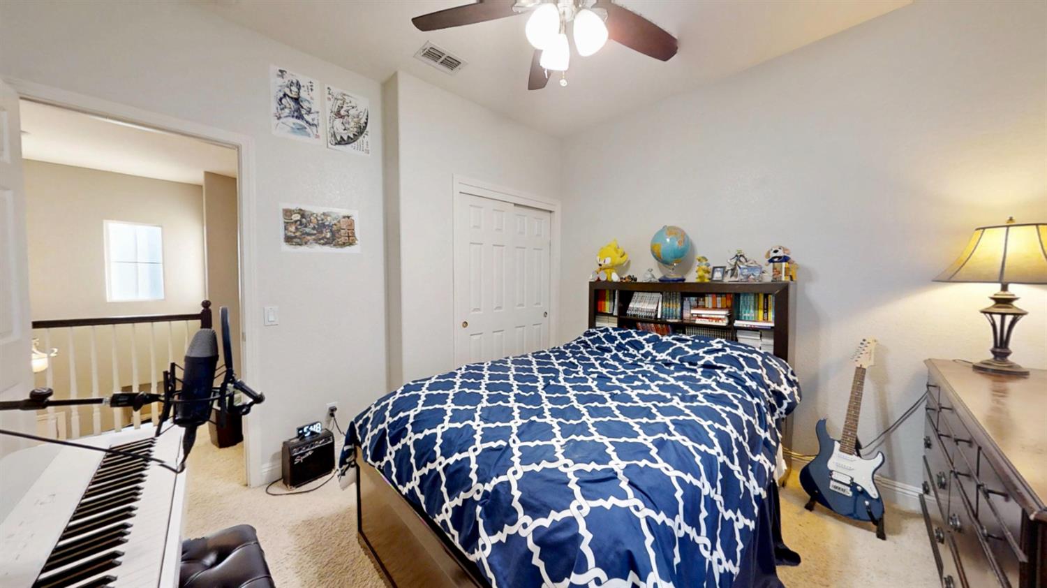 9573 Spring River Way Elk Grove, CA 95624 - Photo 29 of 53 a bedroom with a bed and a chandelier