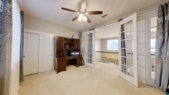a view of livingroom with hardwood floor and a ceiling fan