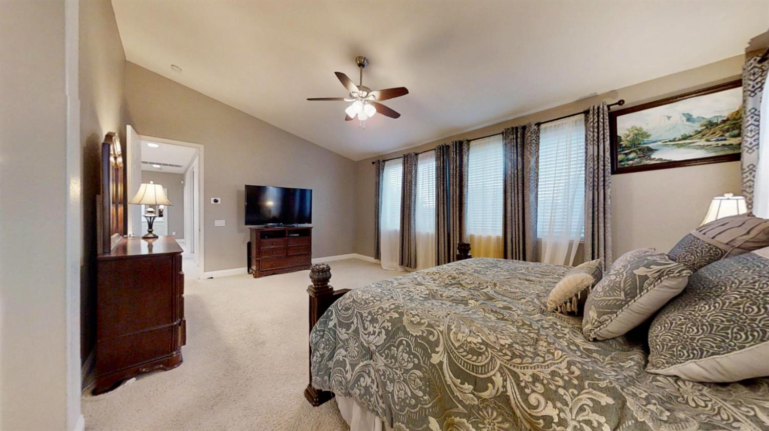 9573 Spring River Way Elk Grove, CA 95624 - Photo 43 of 53 a bedroom with a bed and a flat screen tv