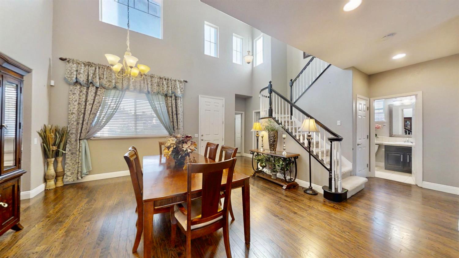 9573 Spring River Way Elk Grove, CA 95624 - Photo 5 of 53 a dining room with furniture entryway and wooden floor
