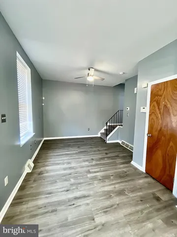 a view of a ceiling fan and window