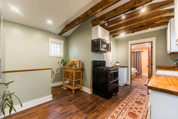 a view of a livingroom with furniture and a flat screen tv