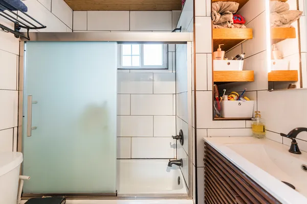 a bathroom with a sink and a shower