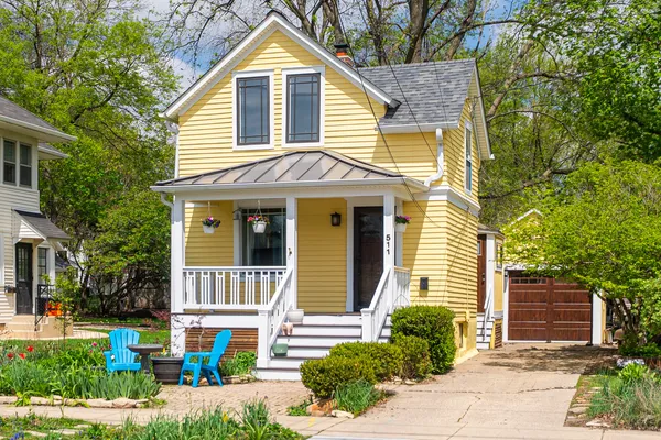 a view of a house with a yard and plants