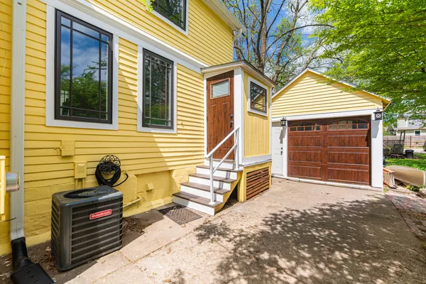 a front view of a house with garage