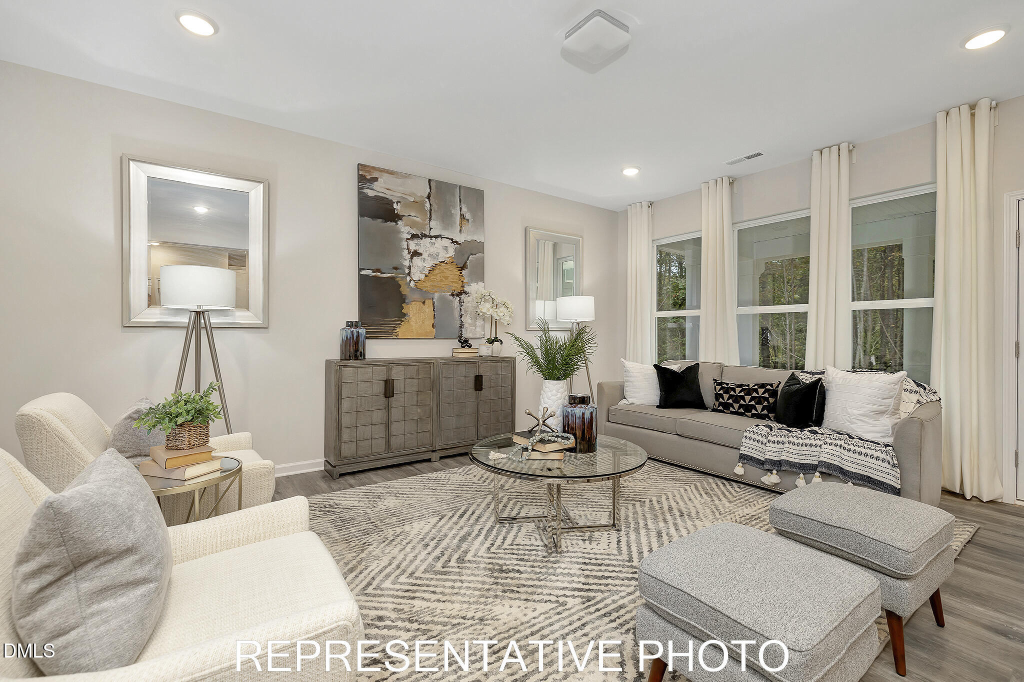 2736 River Meadow Spring Hope, NC 27882 - Photo 2 of 17 a living room with furniture and a large window