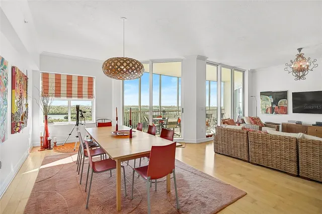 a view of a dining room with furniture window and outside view