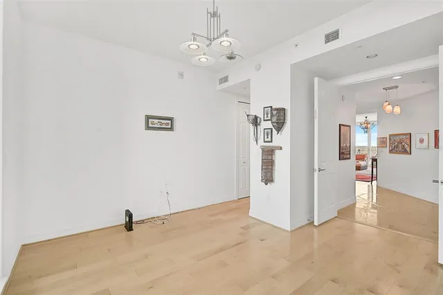 a bedroom with two beds and a window