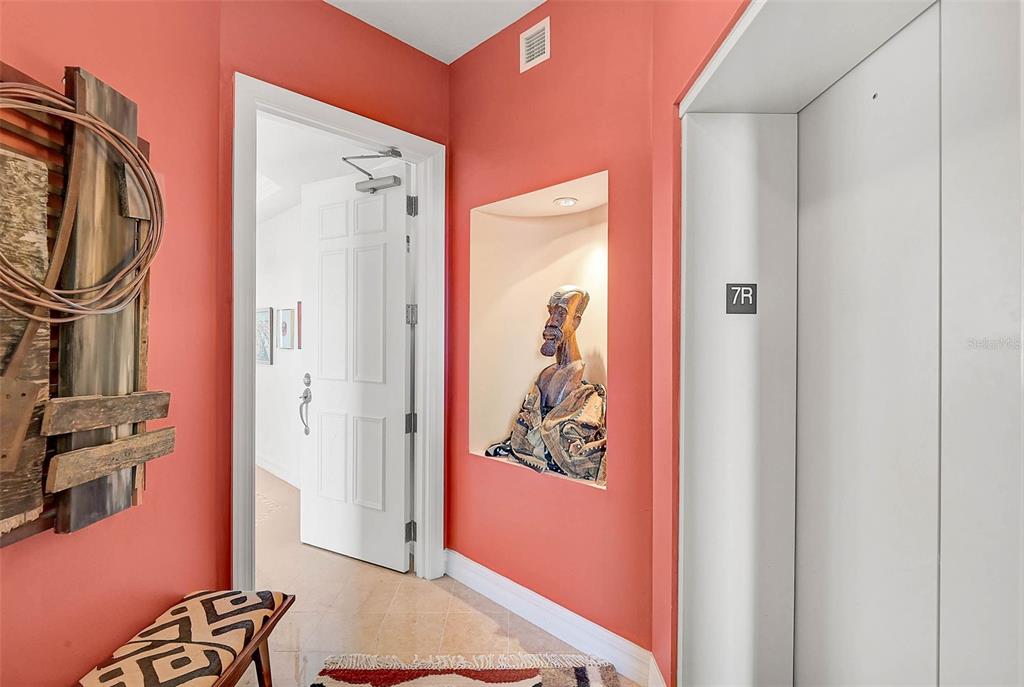 3603 North Point Road, Unit 702 Osprey, FL 34229 - Photo 4 of 61 a view of walk in closet with clothes and shoes