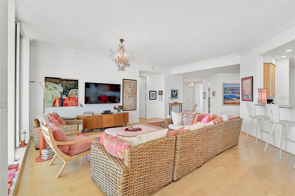 3603 North Point Road, Unit 702 Osprey, FL 34229 - Photo 7 of 61 a living room with furniture and a flat screen tv