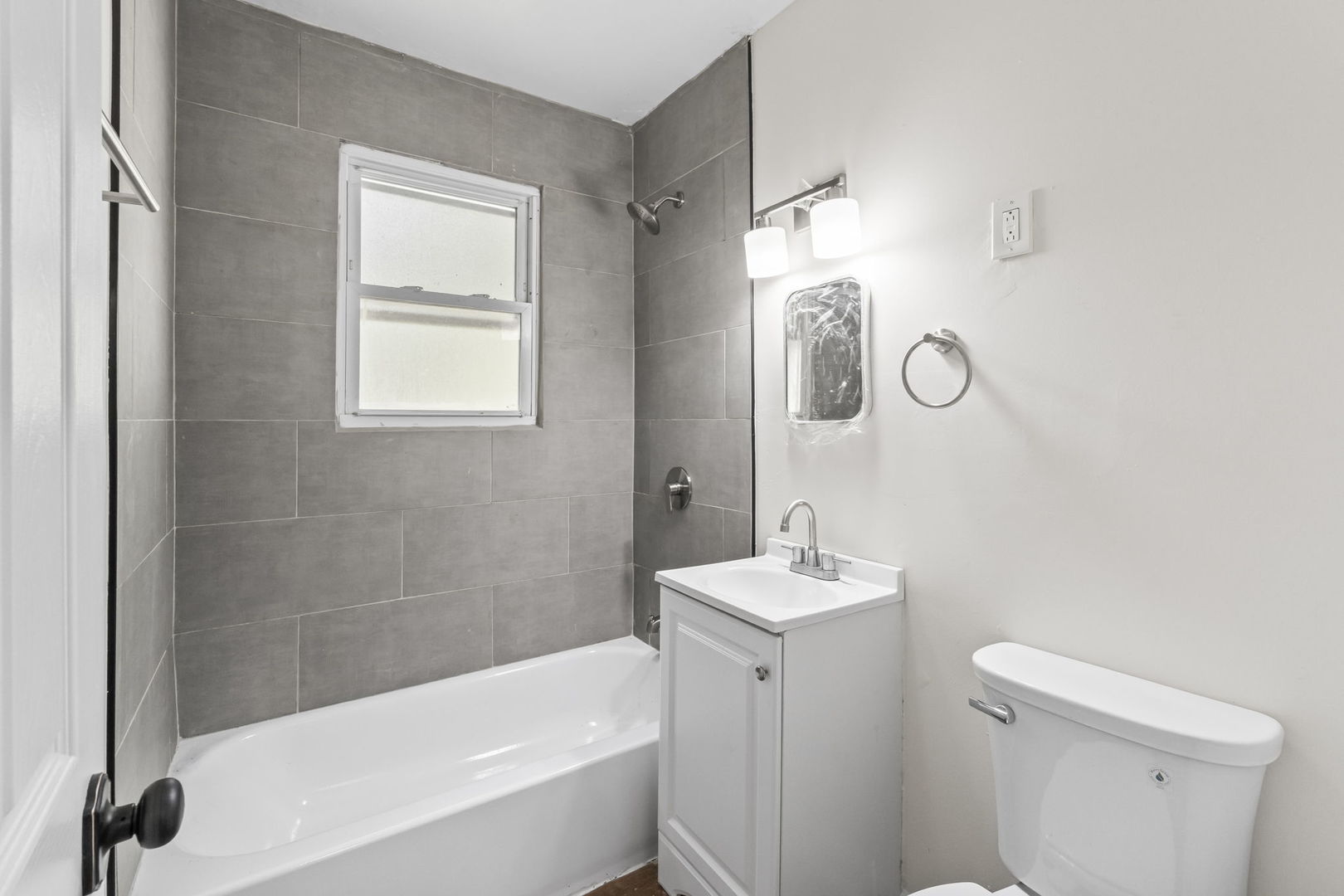 16608 Sawyer Avenue Markham, IL 60428 - Photo 18 of 19 a bathroom with a sink a toilet and shower