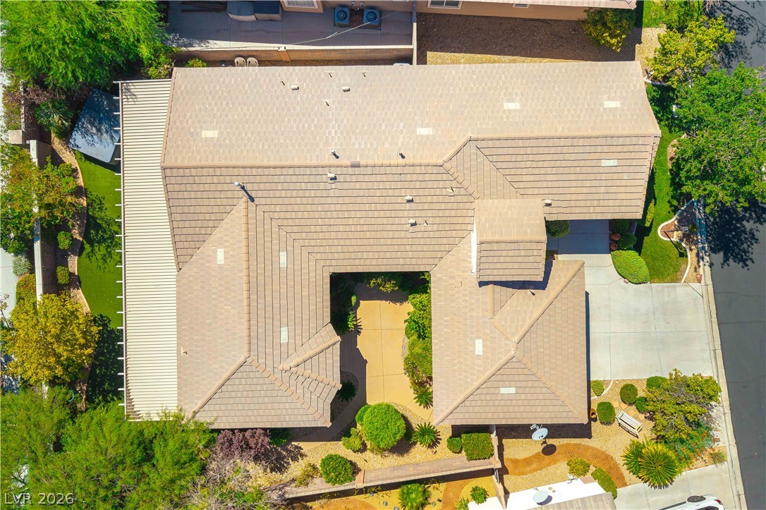 3334 Garden Shower Place Las Vegas, NV 89135 - Photo 28 of 32 An aerial perspective showcases the tiled roofline and structured landscaping of this property.