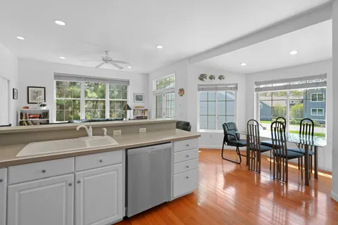 a kitchen with stainless steel appliances a refrigerator sink and stove