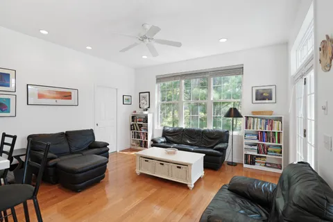 a bedroom with furniture and a flat screen tv