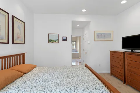 a spacious bathroom with sink shower and bathtub