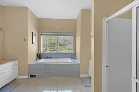 a bathroom with a sink a vanity and a mirror
