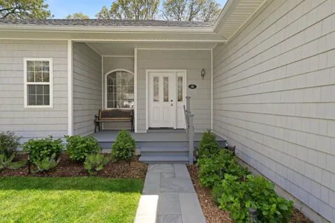 a view of house with backyard