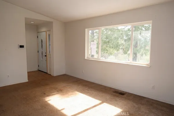 a view of a kitchen center island with wooden floor and fan