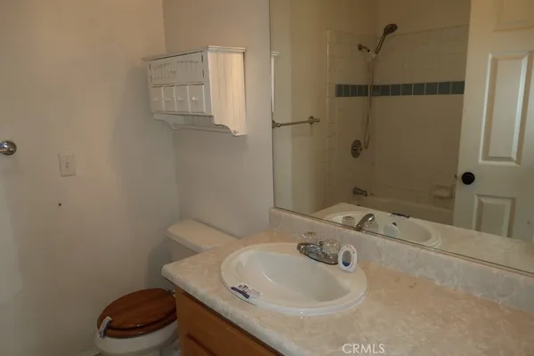 a bathroom with a shower and a toilet