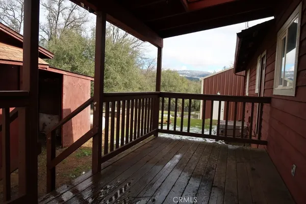 a view of balcony with wooden floor