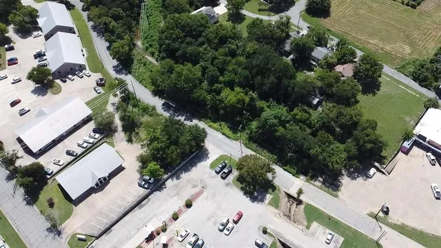 an aerial view of residential house with outdoor space and street view