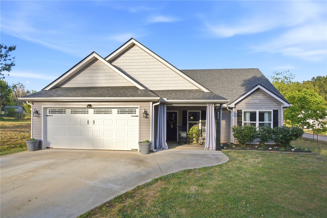 400 Green View Court Westminster, SC 29693 - Photo 26 of 33 This charming home offers convenient garage access and a welcoming covered porch, ideal for relaxation.