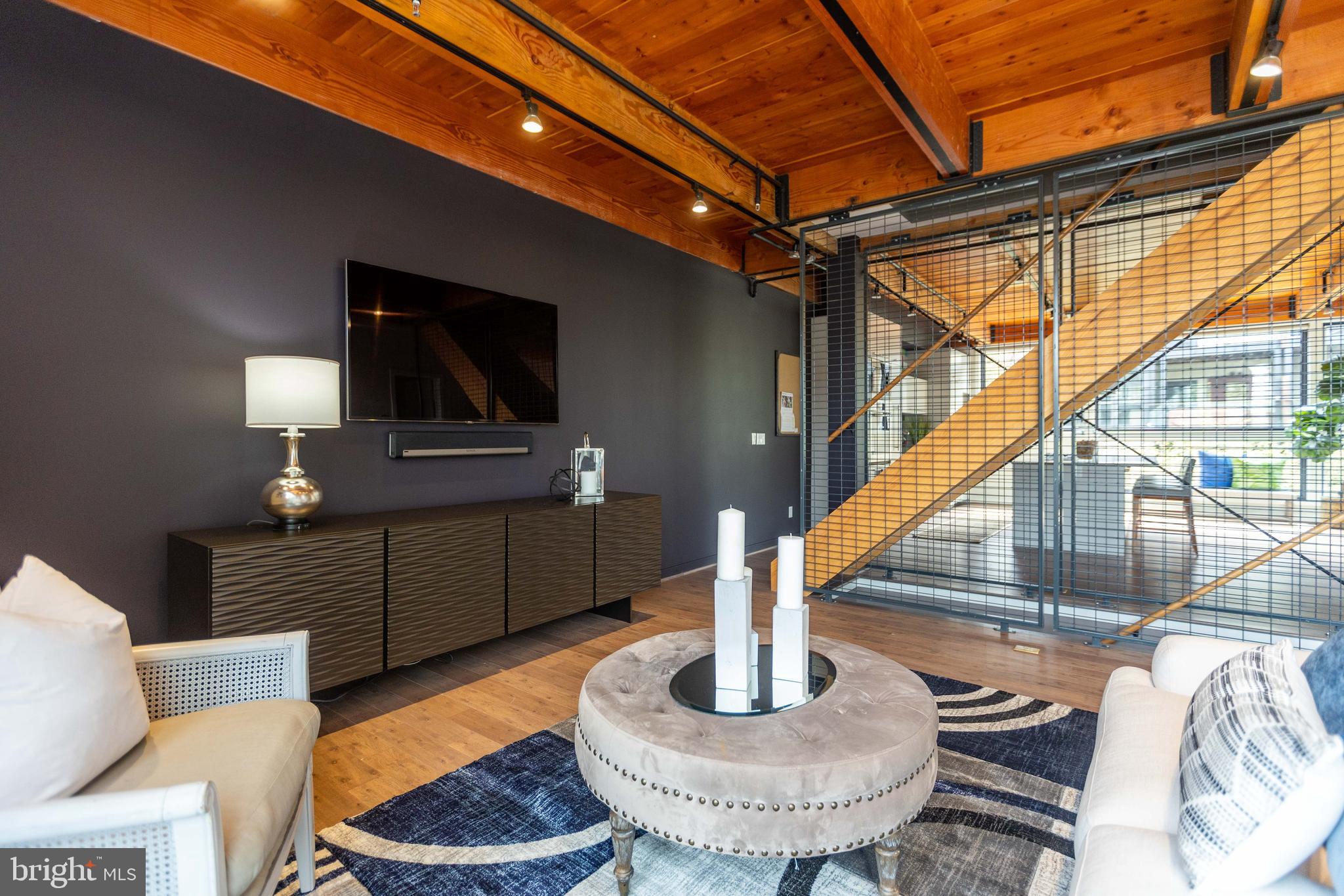 2074 Eric Shaefer Way Baltimore, MD 21211 - Photo 12 of 56 a living room with furniture and a flat screen tv